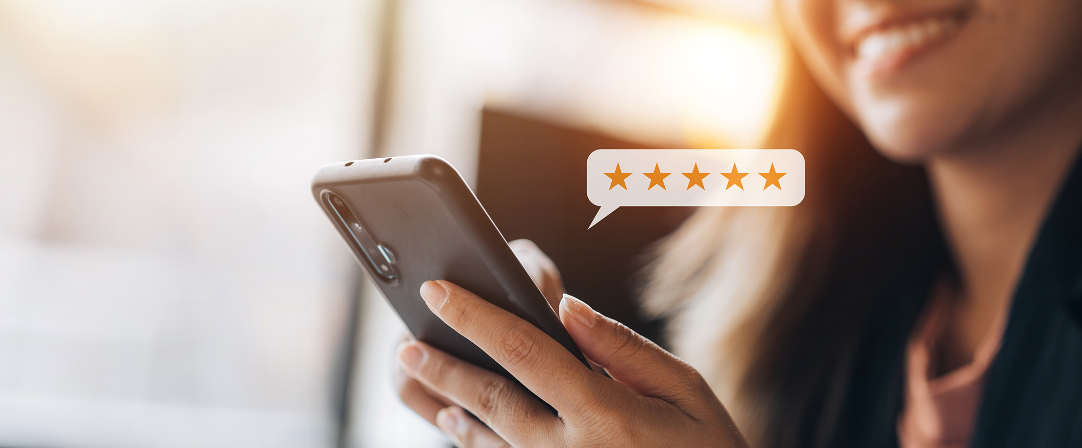 Rate aus A person submits an online review using a mobile phone
